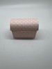 Image shows a small pink "treasure chest" style of paper gift box. 