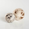 This image compares our small wool ball for cats to our larger wool ball.  
Catnip free cat balls for cats who love to bat and chase - Cats love the natural texture of wool - Plastic free/Washable