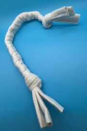 Image shows a very small hand braided organic cotton dog tug toy.  It is white and is displayed against a blue background.  Plastic free natural dog toys by Purrfectplay.  Handmade in the USA.  