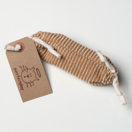 The image shows a brown striped cat toy on a grey background. The toy is 6 inches long. The toy is in the shaped of a sausage and has white ties on the ends. There is a brown tag on one end.