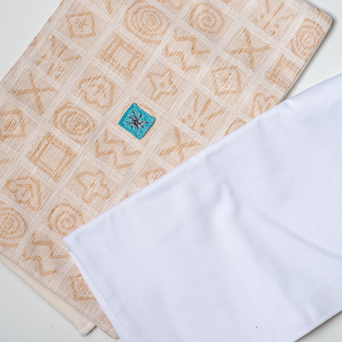 Organic cotton catnip sleep pads in golden brown and white.