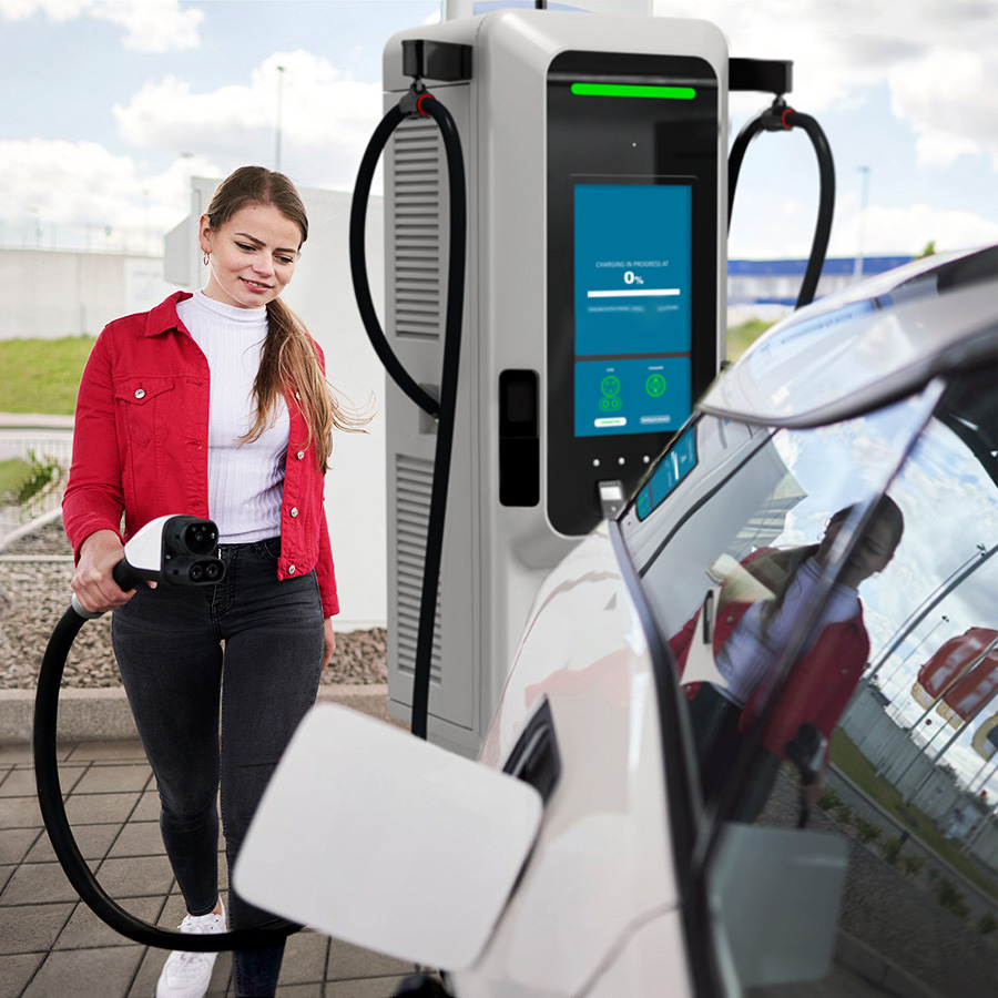 Girl charging car at station