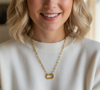 Oval Paperclip Charm Necklace. A beauty, this one! Our 18K gold-plated stainless steel necklace with a unique oval link design and functional charm clasp is an absolute stunner. Perfect for adding a touch of gold to any outfit.