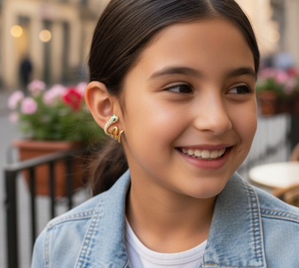 Snake Wraparound Earrings, a one-of-a-kind and flashy set of earrings that wrap around your ear, with a green eye and a textured finish, crafted in 18K gold-plated stainless steel, and modelled in a sunny spot out in the city.