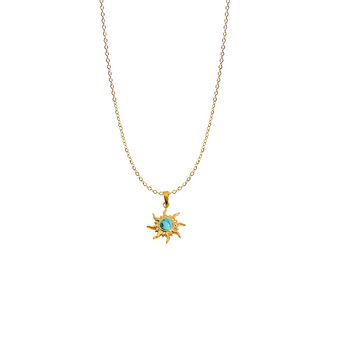 A detailed shot of a round, sunburst-designed pendant featuring a small genuine turquoise gemstone in the centre. The pendant is attached to a delicate 18k gold-plated sterling silver chain.