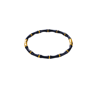 Close-up of the Eterna Band Bracelet in 18k gold-plated stainless steel, showing the detailed black bone enamel inlay against a clean white background.