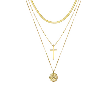 Close-up of Keira K's Cross and Karma Layered Necklace featuring three elegant gold chains with a small cross and karma circle pendant, beautifully displayed on a crisp white background.