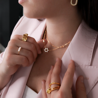 A model wearing the  Magen David Necklace in gold by Keira K Jewellery