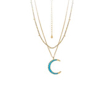 Close-up of Keira K's Aqua Moon Layered Necklace, showing the two delicate gold chains and small turquoise gemstones against a clean white background.