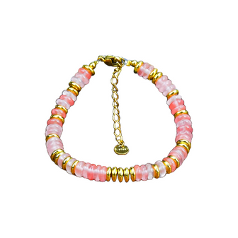 An energy-activated Cherry Quartz gemstone bracelet with vibrant pink hues on an 18k gold-plated chain, perfect for a trendy young style.