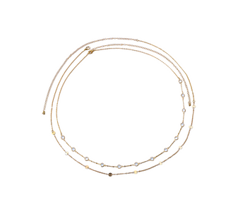 Detailed close-up of the Keira K Dorado Frost Body Chain, highlighting the multiple clear zircons on the gold chain.