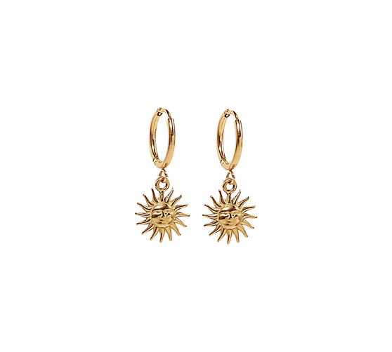 A detailed close-up of the Sun Drop Earrings by Keira K, showcasing the intricate sun charm and shiny 18k gold-plated finish against a clean white background.