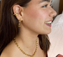 Model wearing Hardwear Medium Link Earrings, showcasing their bold 18K gold-plated design and confident style.