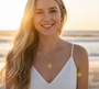 Golden Sun Radiance Necklace. This ripper of a necklace is a real stunner! Featuring a beautiful sun pendant crafted from 18K gold-plated stainless steel, it's the perfect piece for a day at the beach. As you can see, it looks an absolute treat on our model.