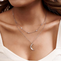 Model wearing a Crystal Moon Double Layered Necklace with a half-moon pendant and Moissanite gemstones in Silver.