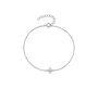 A close-up studio shot of a delicate 18k white gold-filled chain bracelet featuring a four-point North Star charm with tiny zircons at its centre, presented against a clean white background.