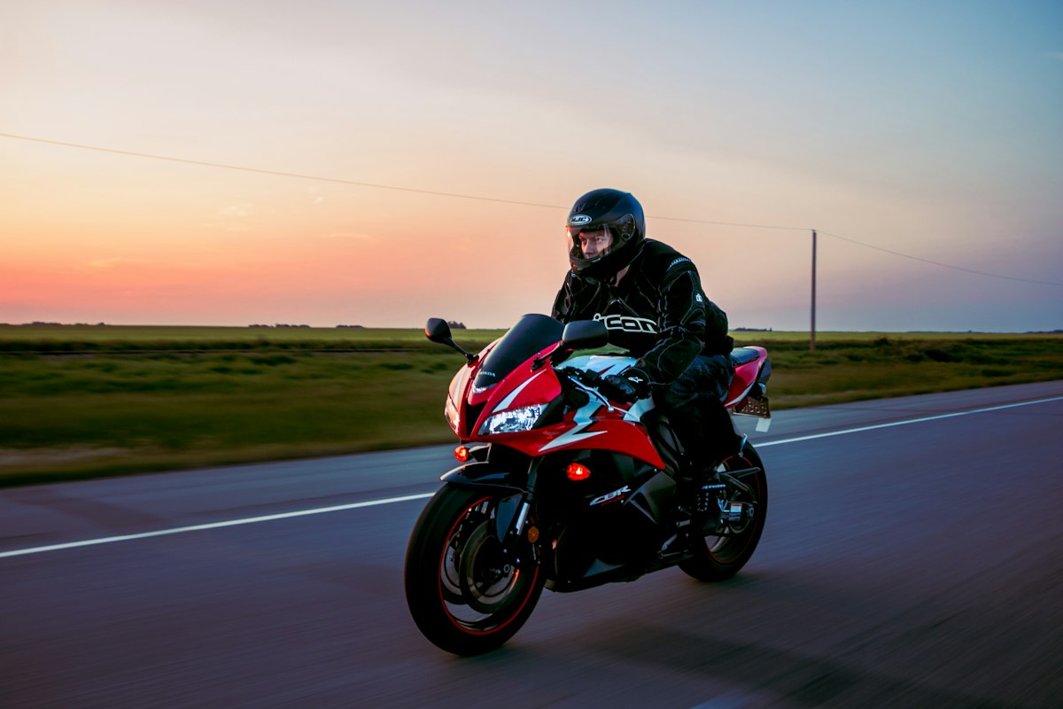 Street sport bike riding at sunset