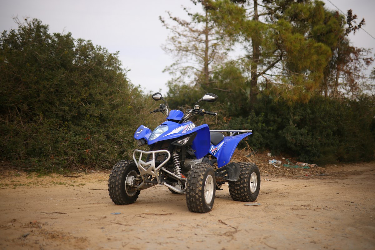 ATV parked on a dirt trail