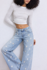 Mid-rise jeans with glitter stars on front and back pockets