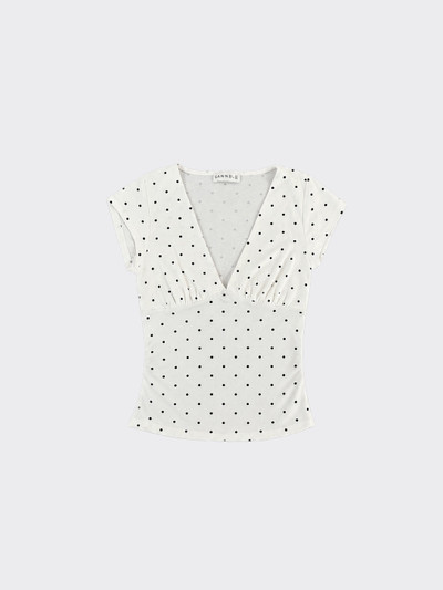 White polka dot V-neck ruched top