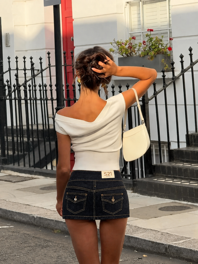 Denim skirt with buttons on the side