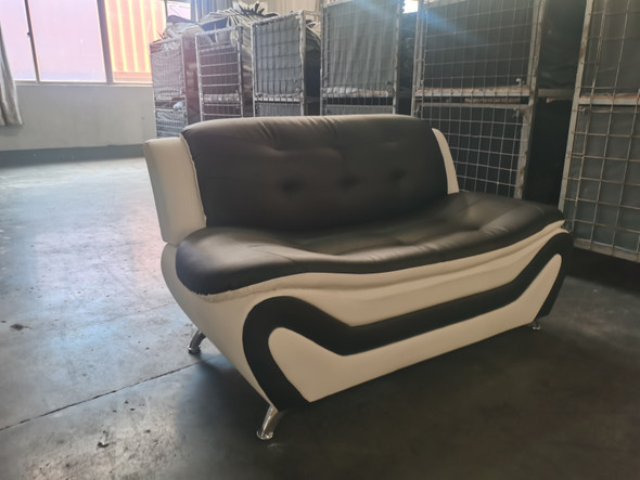Black and White Faux Leather Loveseat with Tufted Back and Chrome-Finished Legs