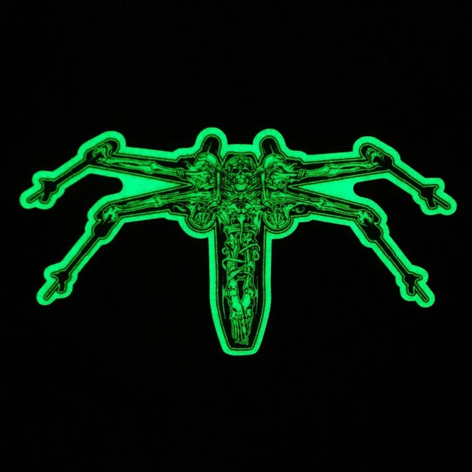 Glow in the dark vinyl sticker.