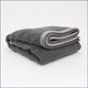 Tuc Fleece Weighted Blanket folded on white background.