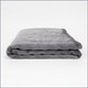 Tuc Kids Warm Weighted Blanket folded on white background.