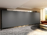 Large gray mobile room divider spanning a lounge area with modern seating and side tables.