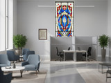 Bright lounge area with seating and two semi-private workstations formed by gray partition panels beneath a stained-glass window.