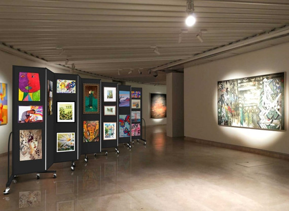 Art gallery with rolling display panels showcasing framed artwork, arranged in a spacious exhibition hall with overhead lighting.