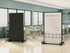 Bright multipurpose room with tables and chairs, featuring two wheeled divider panels, one displaying a whiteboard with diagrams.