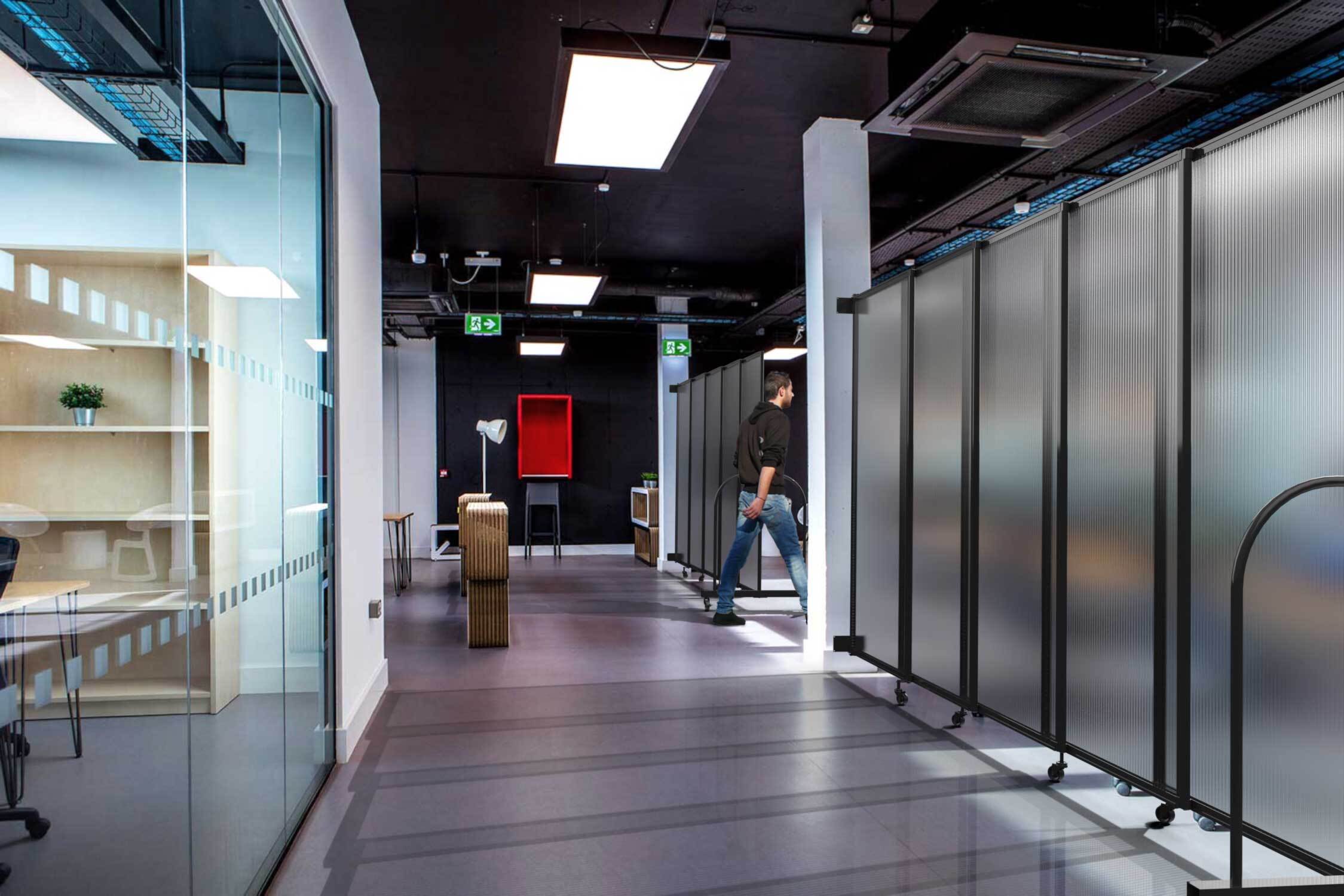 This office uses wall-,mounted polycarbonate that can transform from big hall to an alternative space