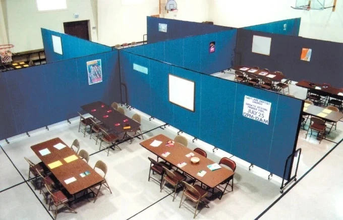 Using space efficiently by creating meeting rooms in a gym with room dividers Using space efficiently by creating meeting rooms in a gym with room dividers