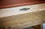 Brunswick Sagrada pool table rail detail with classic Brunswick emblem logo 