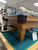 Pre-owned 8 foot Olhausen Classic pool table in American walnut on oak with ball return system and Accu-Fast cushion