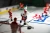 Closeup of Miracle on Ice themed player figures and uniforms inside Super Chexx Pro rink