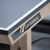 Close up of Cornilleau 850W grey 25mm Skiltop playing surface and beveled wooden apron