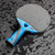 Cornilleau Nexeo X90 carbon outdoor paddle reverse side showing weatherproof sponge backed smooth rubber


