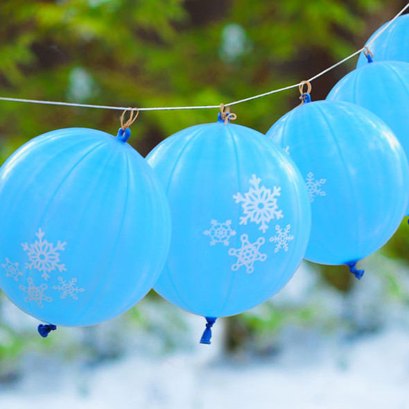 Snowflake Punch Balls Hanging Outside