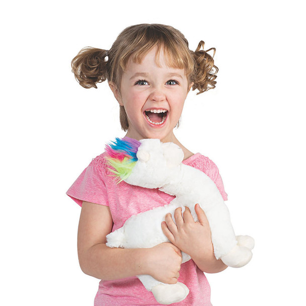 Girl holding white plush llama - happy smile