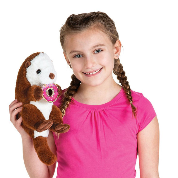 Girl holding carnival prizes - stuffed animal otter