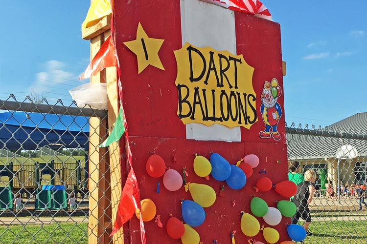 Dart balloons sign at school carnival - for blog 3 items every booth needs