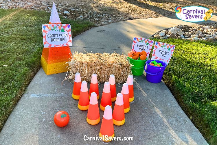 Image shows easy Fall Festival Game idea - Candy Corn Bowling