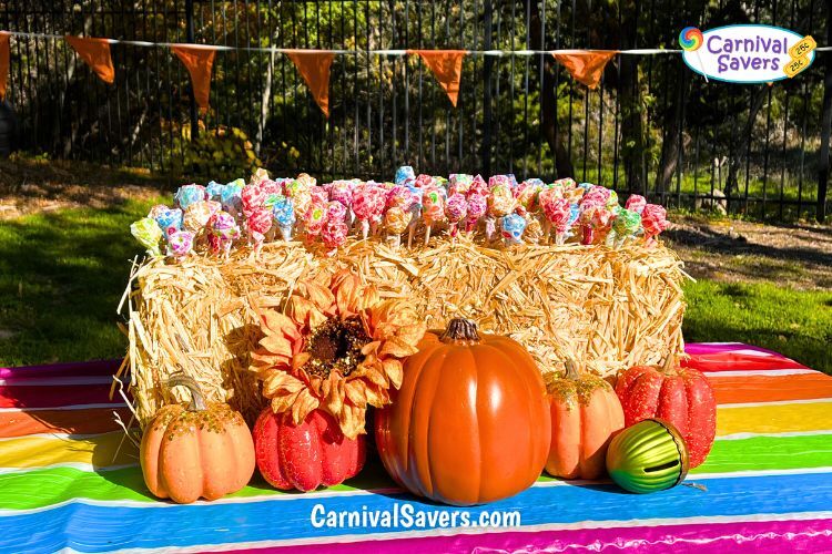 Image shows fall festival game - lollipops in a bale of hay