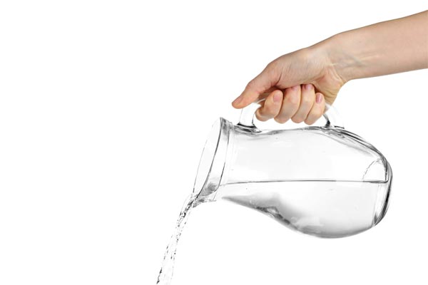 A pitcher pouring out water for a carnival face painting or tattoo booth