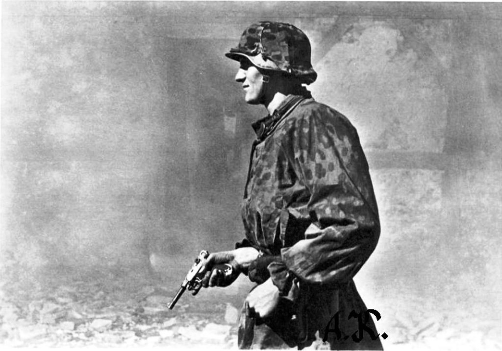 SS Trooper standing with a P08 Luger.