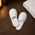 white-cotton-waffle-slippers-open-back-hotel-suite-floor-scene