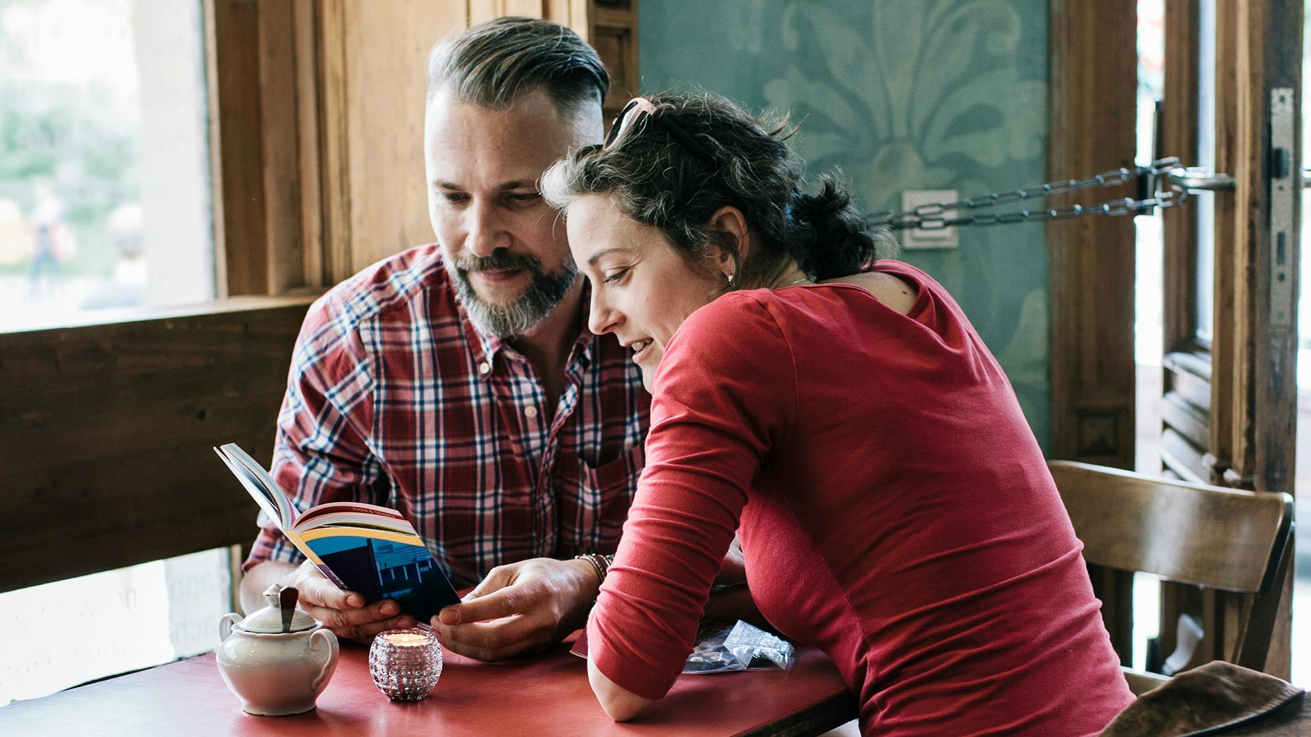 A man and a woman reading book